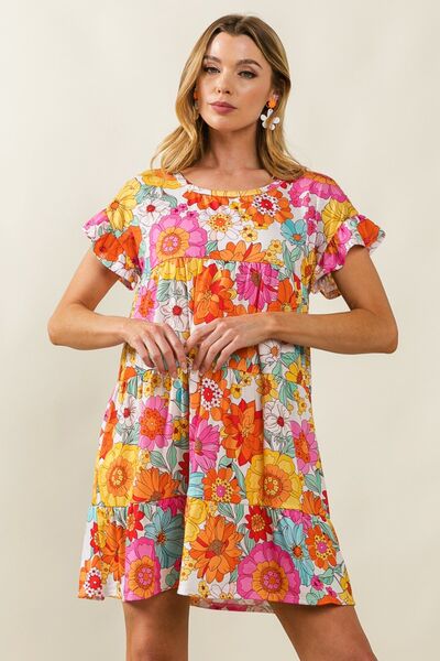 The Floral Short Sleeve Tiered Dress is an inherently versatile, and inexhaustible ensemble for any season, whether occasion calls for fun or formality. That being its charming floral pattern and short sleeves, it exudes that femininity and elegance as a lady. This tiered design adds to the inclusiveness, dynamism, and volume with the intent to give a slim shape to all body shapes