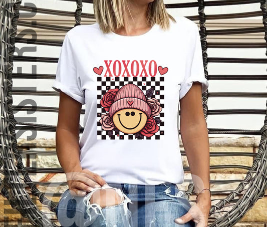 XOXOXO Smiley Valentine Tee Shirt for Women is an adorable and comfortable addition to your wardrobe. Made with soft cotton and featuring a bright smiley face design, this tee is sure to spread joy wherever you go. Unisex Fit , Available in Toddler, Youth, and Adult Small to 4XL.