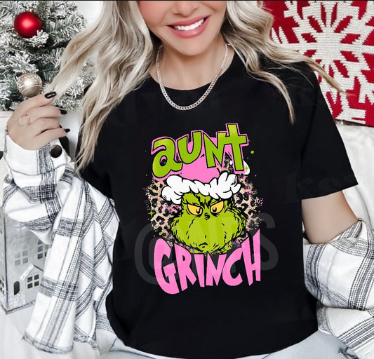 Step into the holiday season with our 'Aunt Grinch Tee' for women. This unique Grinch shirt will make everyone green with envy as you flaunt your festive spirit. women's grinch shirt